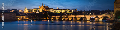 Cityscape of Prague Castle and Charles Bridge at dusk
