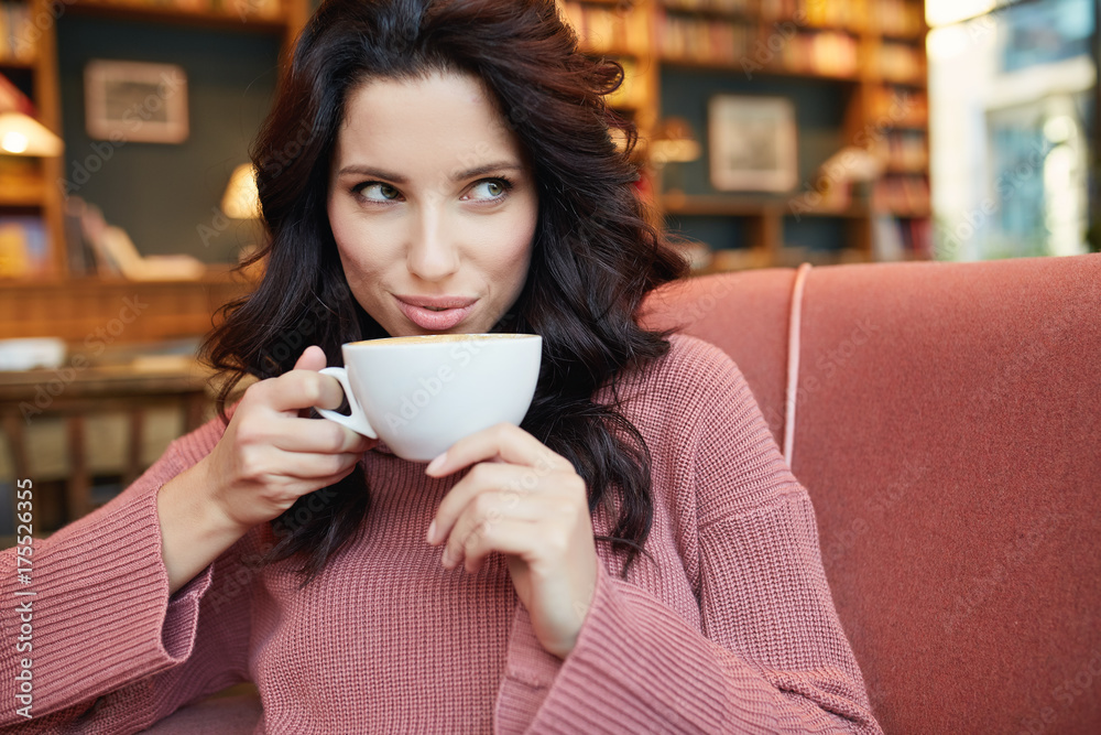 woman drinking coffee in a cafe woman drinking coffee in a cafe