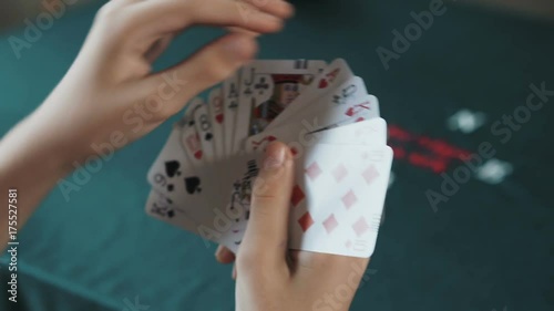 Bridge card game,female hand  shuffling cards close up photo