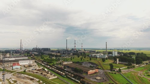 Industrial Zone, aerial view of pipe, railway, warehouse space. Industrial park zone from above, factory chimneys and warehouses, industry district. Urban landscape.