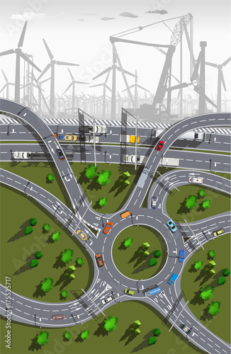 electric wind turbines in the early misty morning and top view expressway