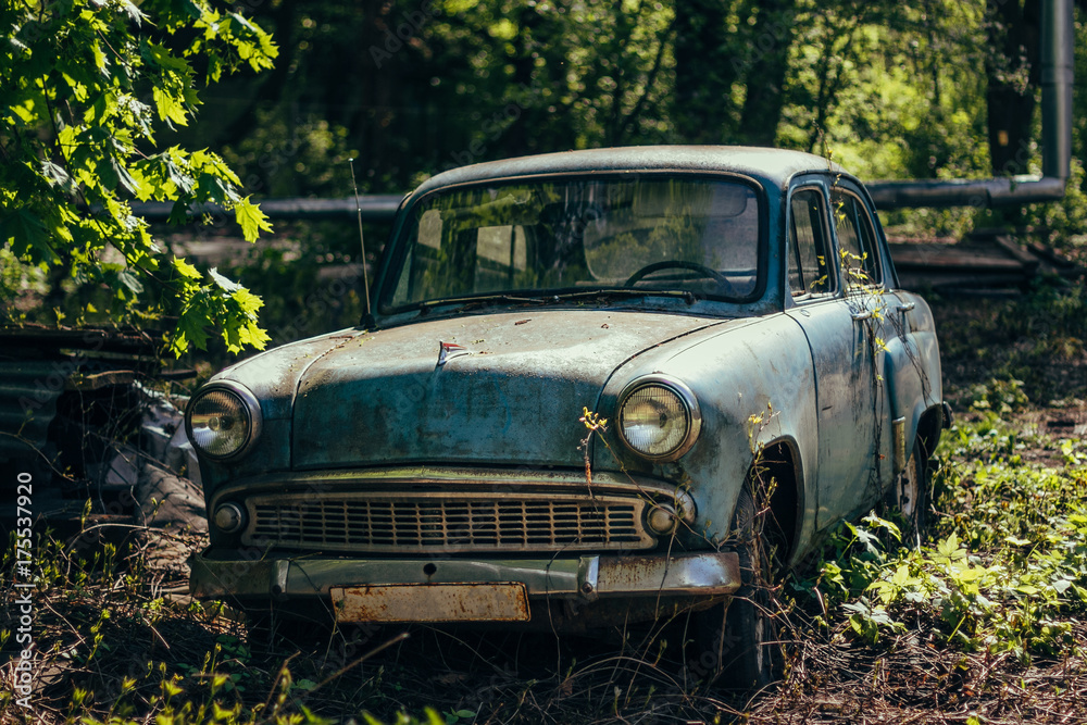 Old rusty overgrown abandoned soviet retro car Old rusty overgrown abandoned soviet retro car