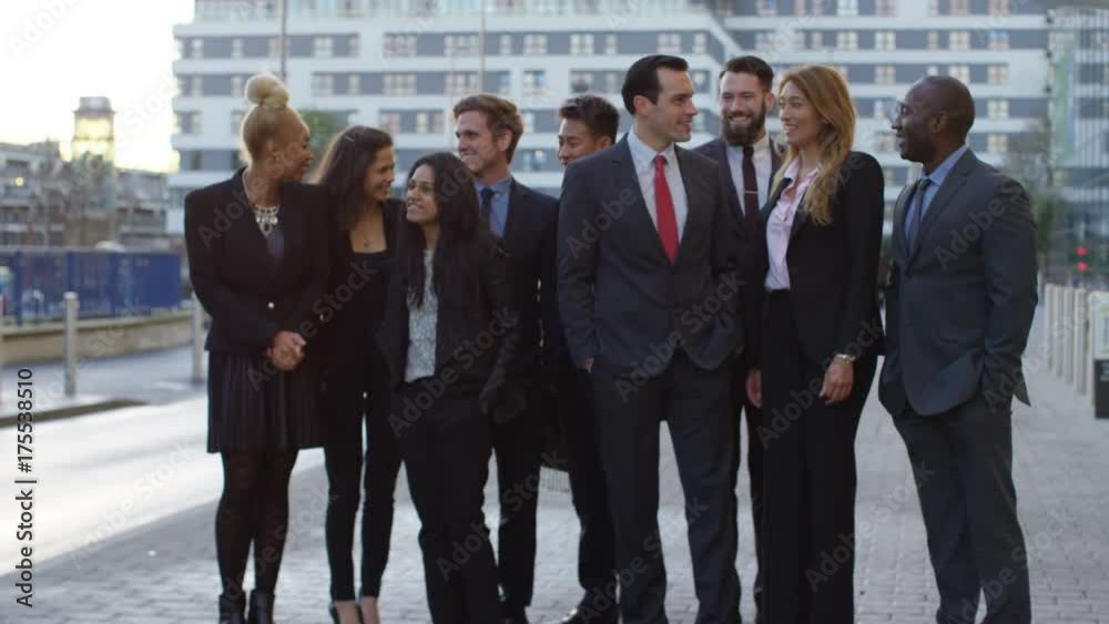 Portrait smiling diverse business group outdoors in the city Portrait smiling diverse business group outdoors in the city