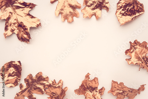 Fall rose gold colored leaves flatlay. Copy space for text