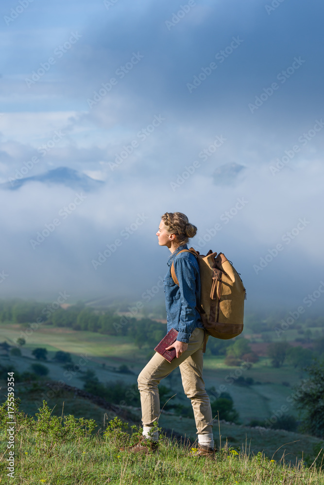 Young woman hiking in the early morning