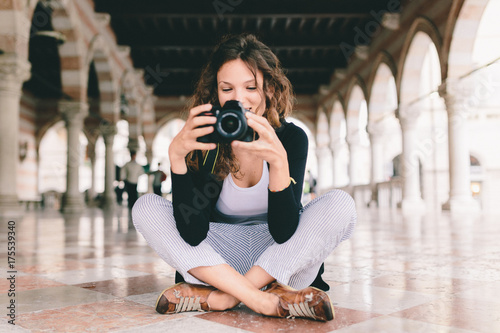 Pretty Young Female Photographer Taking Pictures in Italy photo