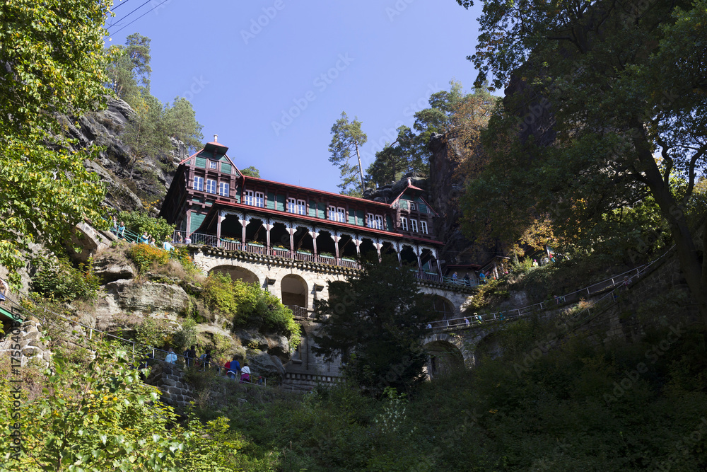 Fototapeta premium Autumn Landscape with historical Building at Pravcice Gate in the Czech Switzerland, Czech Republic