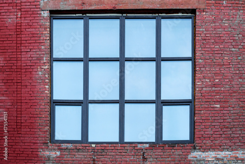 facade of the building with a large square window