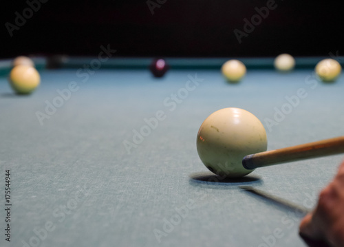Billiards, billiard table. Targeting the cue in the ball for imp