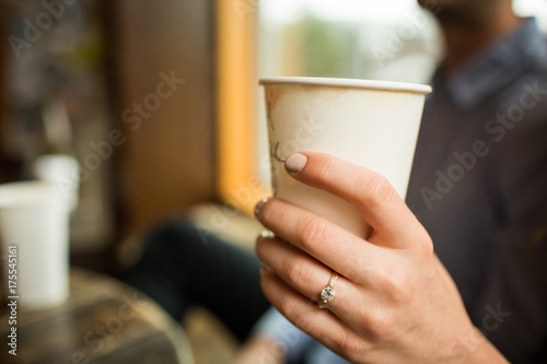 Engagement Ring holding cup of coffee