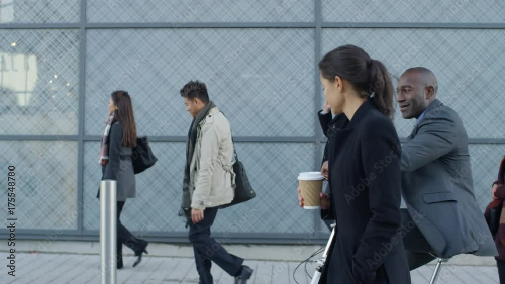 Diverse professional group walking to work in the morning Diverse professional group walking to work in the morning