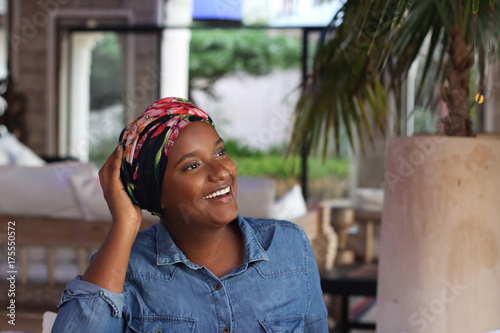 Woman with a scarf smiling