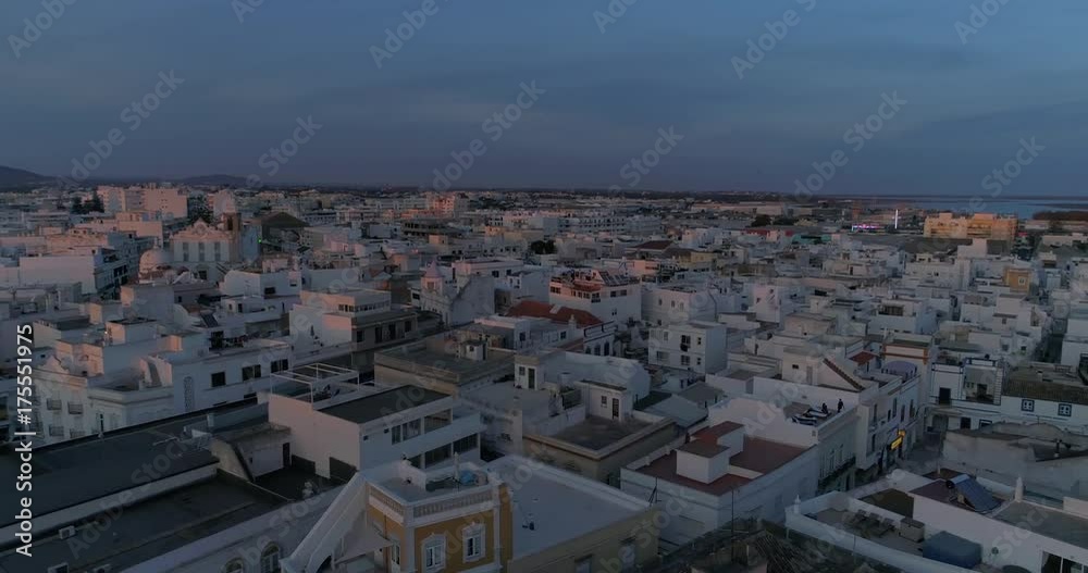 Sunset aerial cityscape in Olhao, Algarve fishing village view of ancient neighbourhood of Barreta, and its traditional cubist architecture. Sunset aerial cityscape in Olhao, Algarve fishing village view of ancient neighbourhood of Barreta, and its traditional cubist architecture.