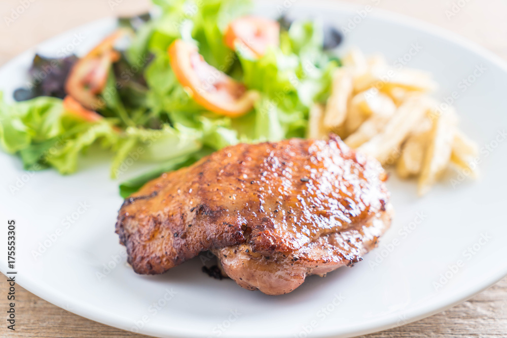 grilled chicken steak with french fries and vegetable salad grilled chicken steak with french fries and vegetable salad