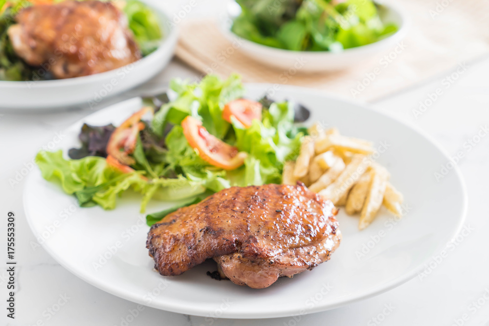 grilled chicken steak with french fries and vegetable salad grilled chicken steak with french fries and vegetable salad