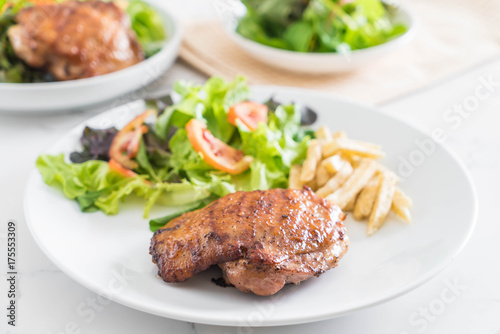 grilled chicken steak with french fries and vegetable salad