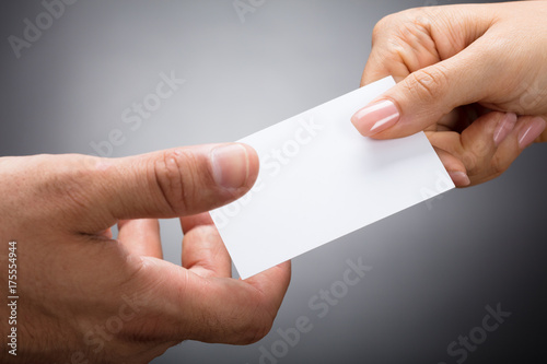 Two Businesspeople Exchanging Visiting Card
