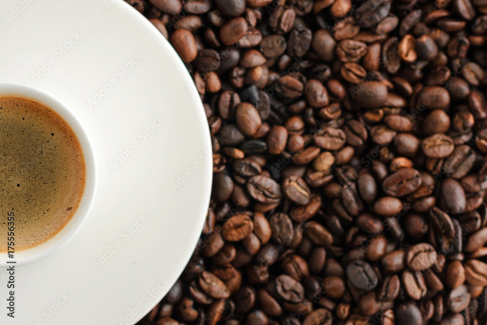 cup of coffee espresso on coffee beans backgroun. close up cup of coffee espresso on coffee beans backgroun. close up