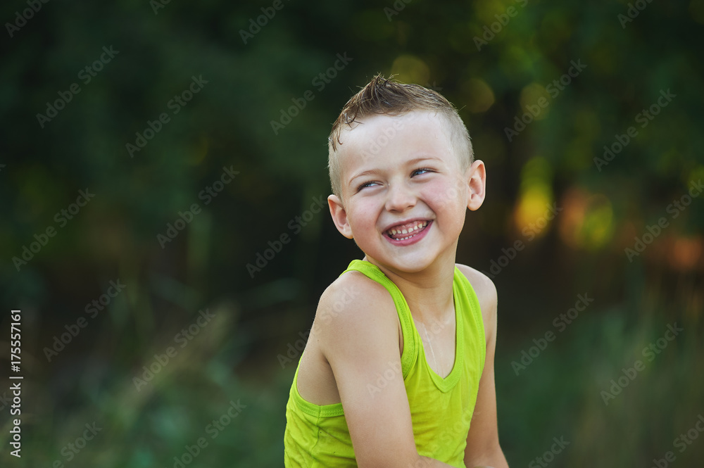 portrait of a cheerful boy in nature