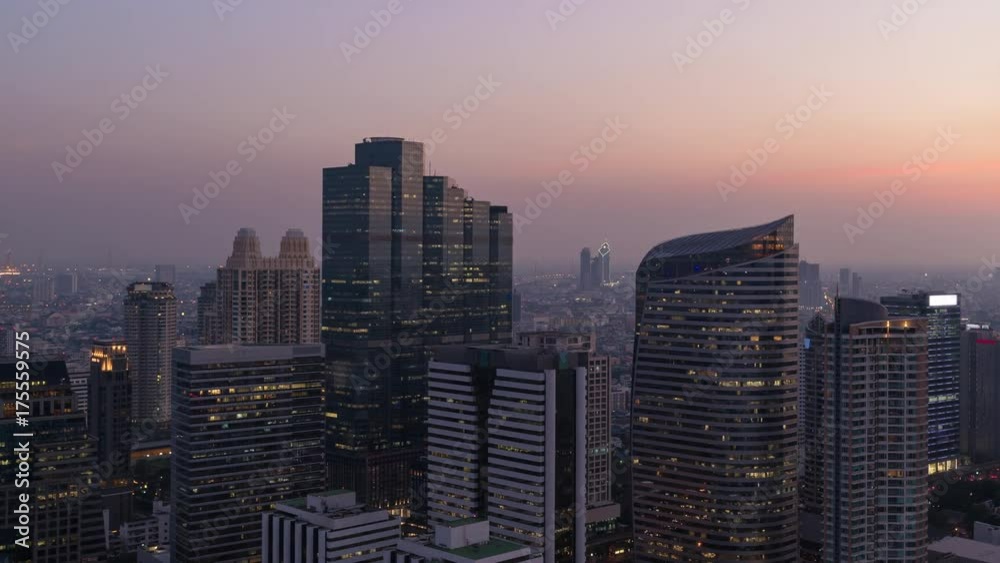 Timelapse day to night cityscape view of modern building in business area town at Bangkok in Thailand Timelapse day to night cityscape view of modern building in business area town at Bangkok in Thailand