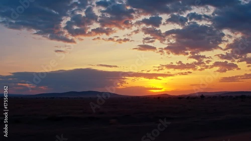 Wallpaper Mural Smooth, sweeping cinematic camera shot of driving through African savanna of Serengeti national park in Tanzania, Africa on a beautiful, breathtaking evening sunset. Torontodigital.ca