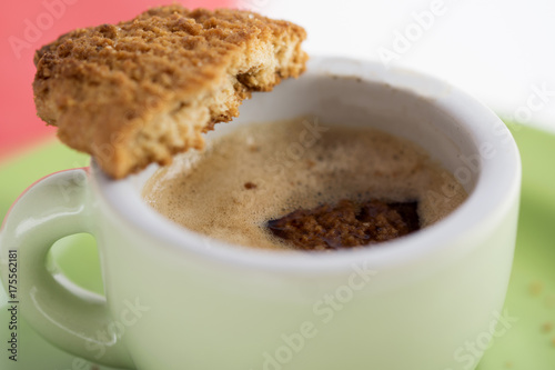 dunking a biscuit in espresso coffee