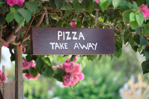 Wooden pizza take away sign board outside photo