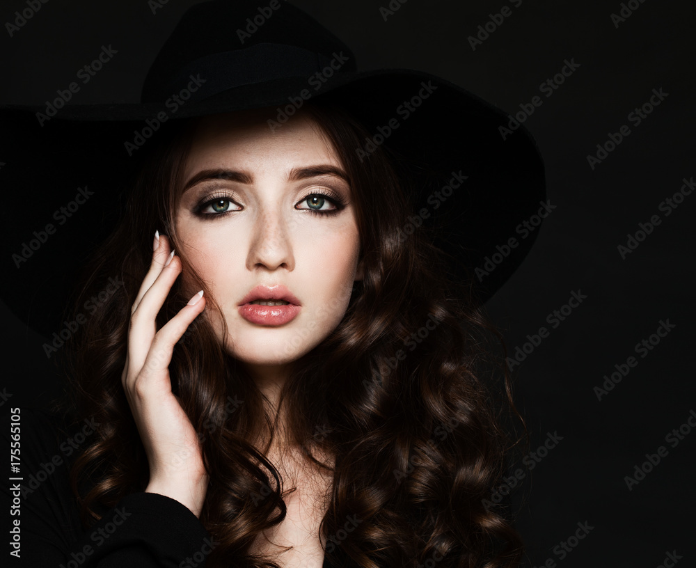 Young Woman with Makeup and Curly Hair on Black Background Young Woman with Makeup and Curly Hair on Black Background