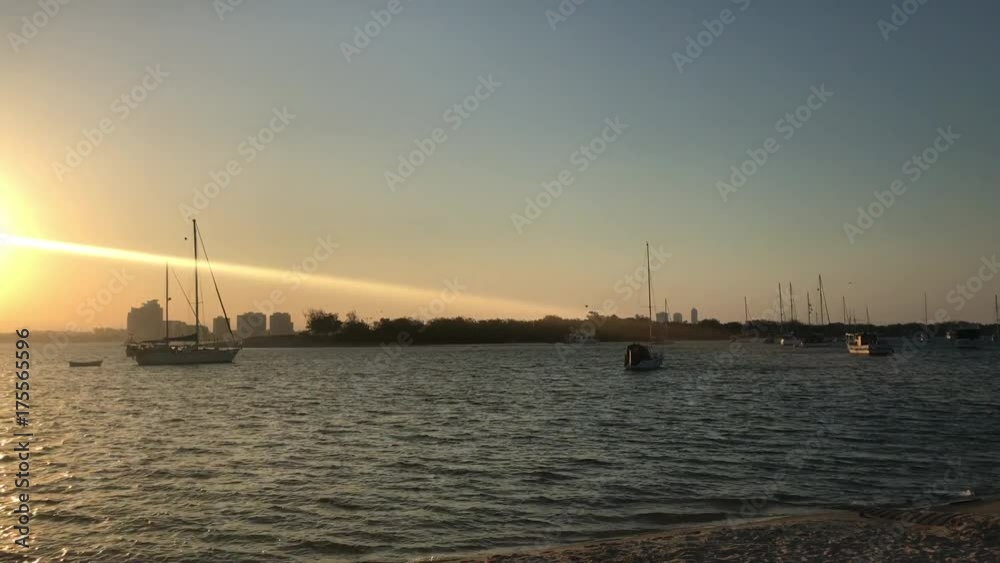 panning into sunset over calm waters panning into sunset over calm waters