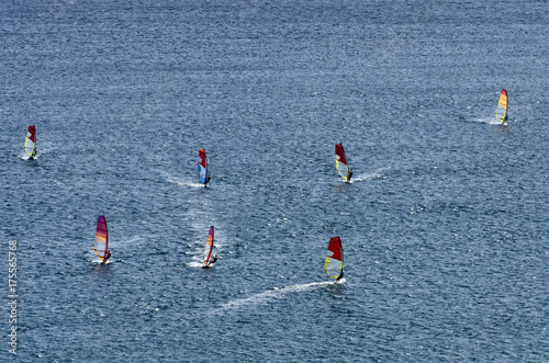 Windsurfers on the sparkling waves of the Mediterranean sea at Cape Prasonisi  Greece 
