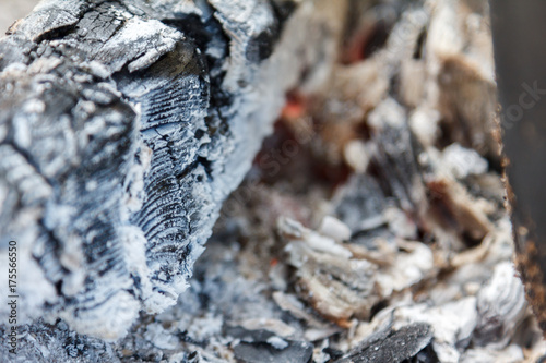 Glowing hot charcoal briquettes close-up background texture. bonfire © bravissimos