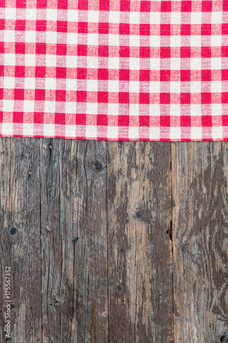 White red squares burlap tablecloth texture on black old wooden rustic background. Christmas background