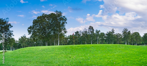 Fototapeta Naklejka Na Ścianę i Meble -  Golf Course where the turf is beautiful and putting green in Hokkaido, Japan. Golf is a sport to play on the turf	