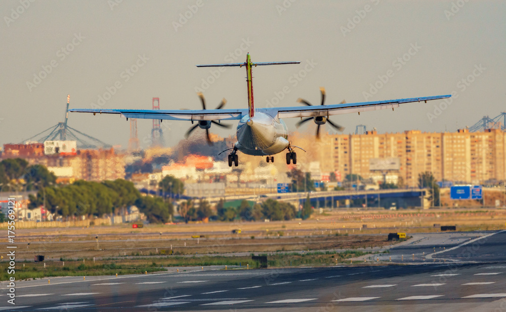 Fototapeta premium Propeller plane landing in the airport
