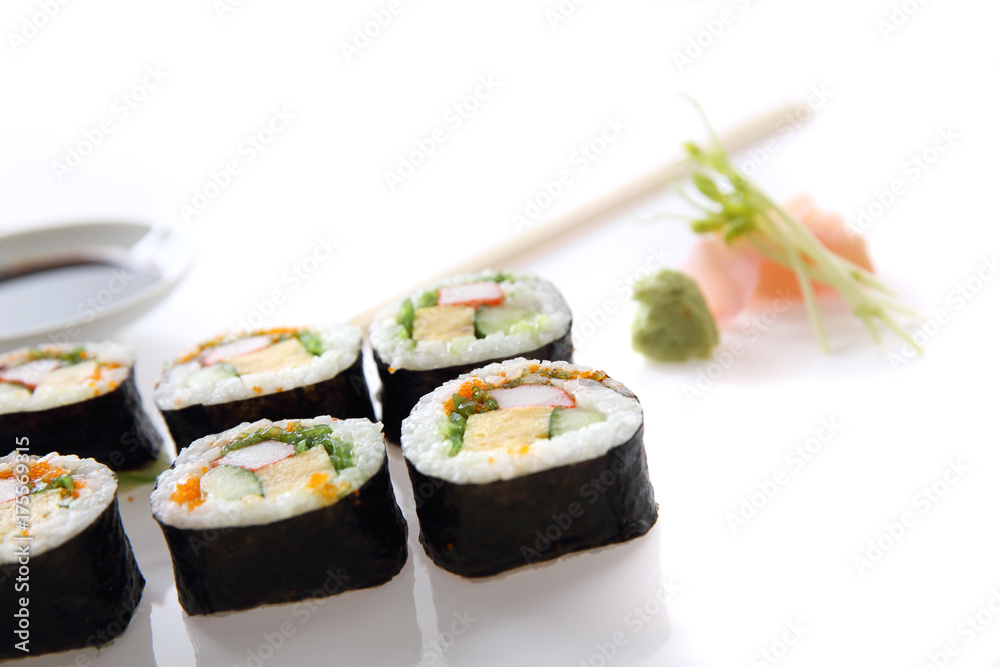 Futomaki sushi , Japanese roll rice egg avocado cucumber and caviar isolated in white background