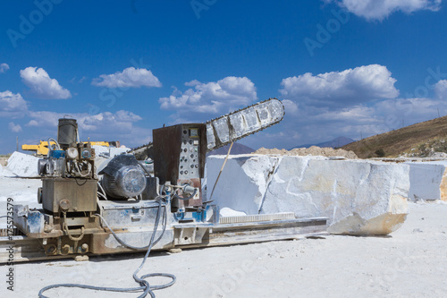Industrial shot illustrating the production of marble. Cutting the rock at the quarry by a giant saw.