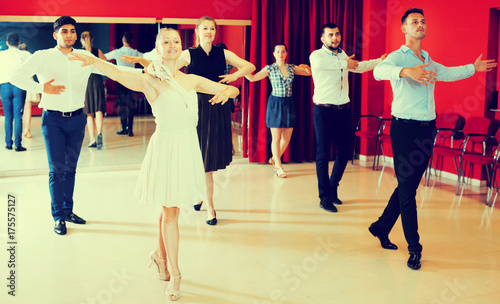 Dancing couples enjoying latin dances