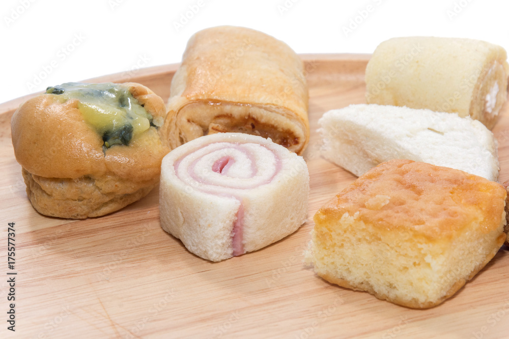 a variety of bakery on wooden plate a variety of bakery on wooden plate