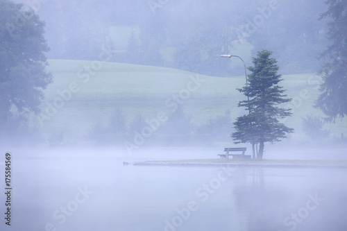 Lake at foggy morning misty weather