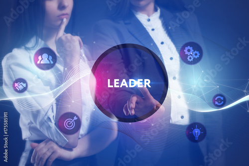 The concept of business, technology, the Internet and the network. A team of business women working on the virtual screen of the future and see the inscription: Leader