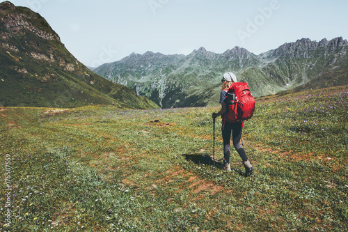 Woman traveler with backpack hiking at mountains Travel Lifestyle wanderlust adventure concept summer vacations outdoor into the wild landscape