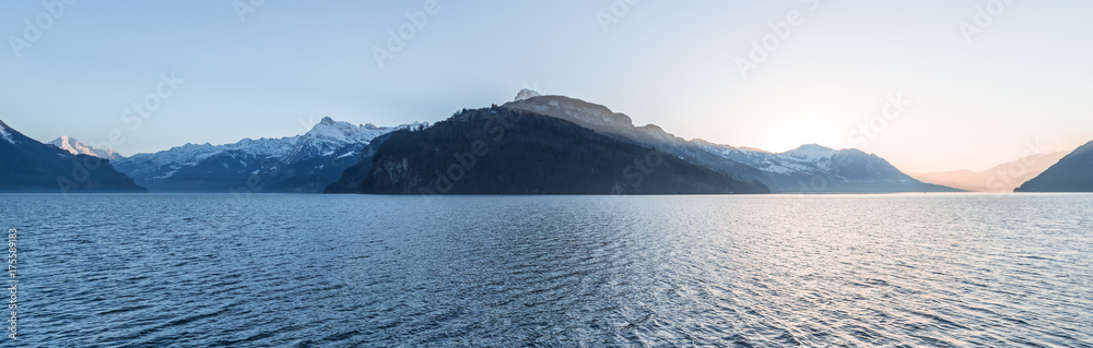 Mountain range of the Alps at sunset. Panorama, landscape of the mountain lake Lucerne. Wide lens. A spacious volume.