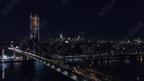 Aerial view of Brooklyn bridge and New York cityscape at night