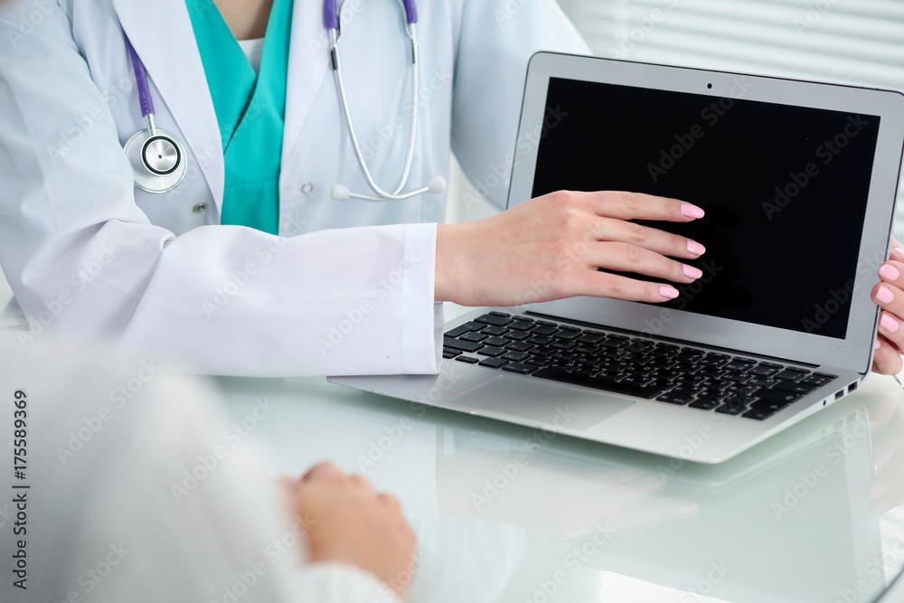Doctor and patient, close-up of hands. Physician talking about medical examination results. Medicine, healthcare and helping concept Doctor and patient, close-up of hands. Physician talking about medical examination results. Medicine, healthcare and helping concept