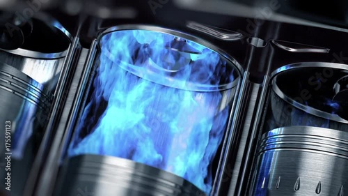 A close-up of engine in slow motion with a blue explosions of fuel