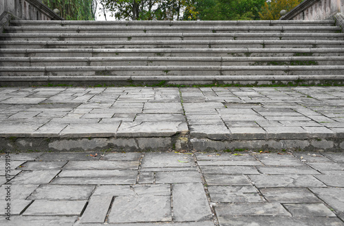Old damaged stone staircase on the bridge, up and down, textured background