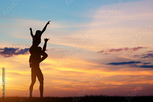 Couple having happy time together at sunset.