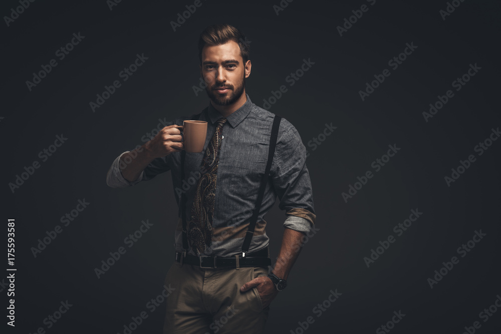 handsome man holding cup