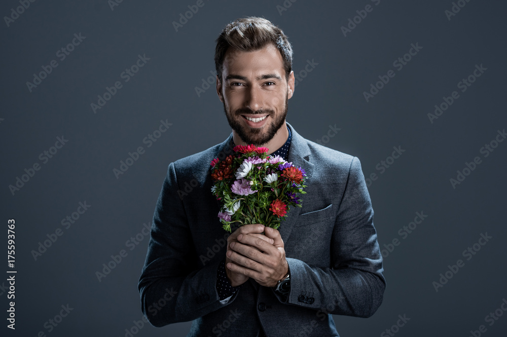 Handsome man holding bouquet Handsome man holding bouquet