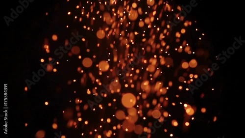 Background of slow motion of firework sparkler burning at night, out of focus